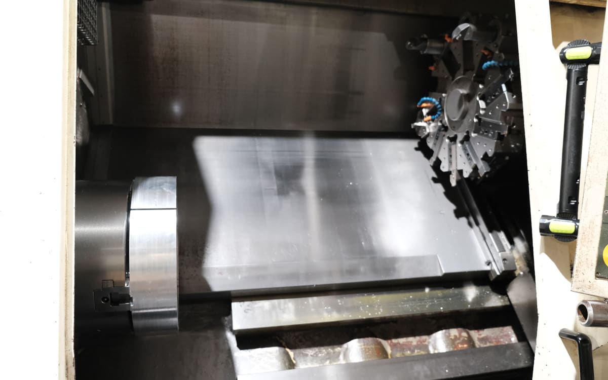 Inside a CNC turning center: chuck, bed, and tool turret